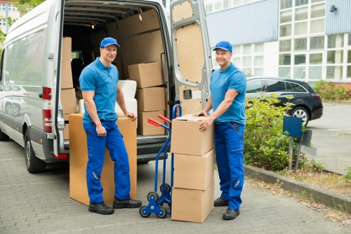 Team unloading boxes and furniture at a North Sheen property